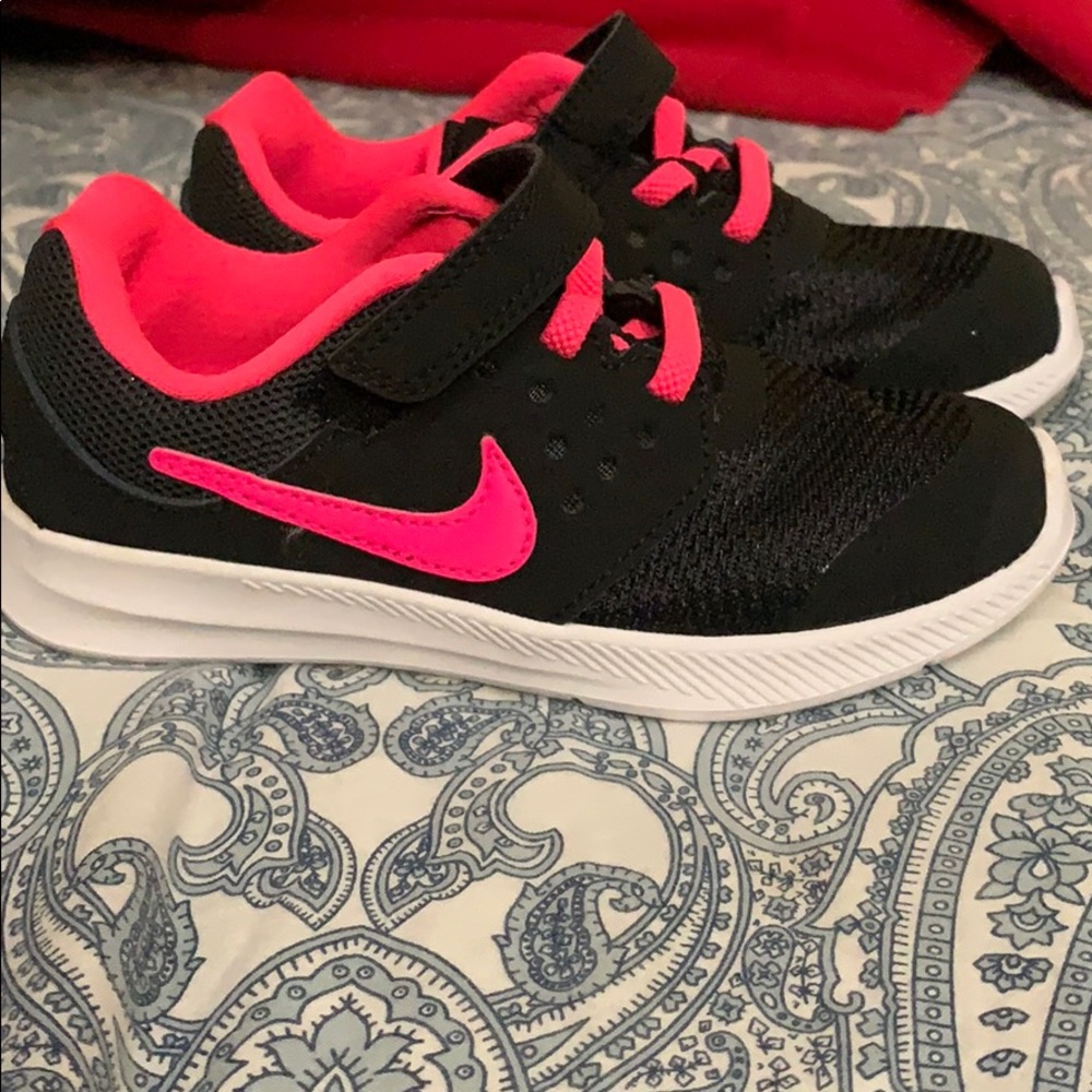 Black and pink kids nike sneaker